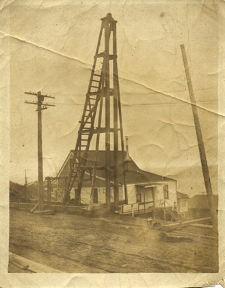 About 1910, Jones home at 712 31st Ave S. Seattle, WA. Paved road and sidewalks are being installed.